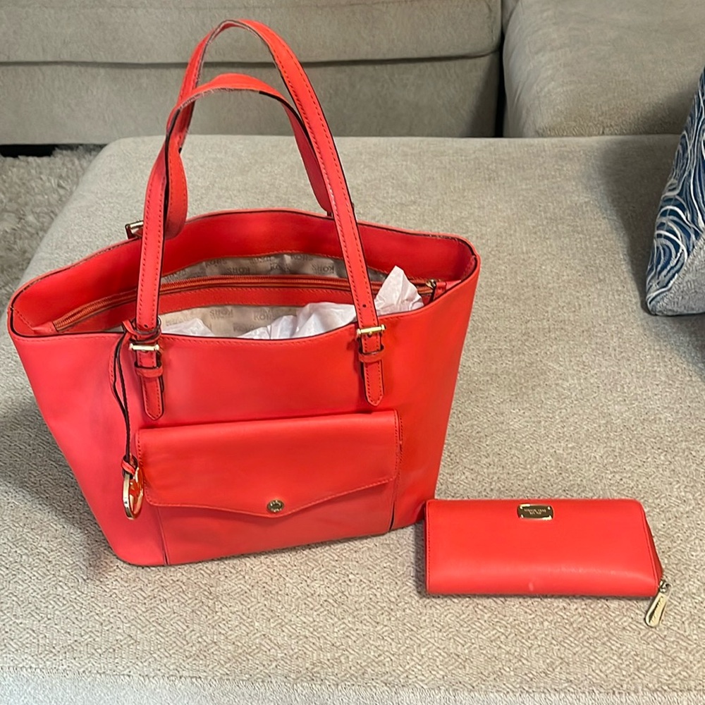 Orange Michael Kohrs purse and matching wallet